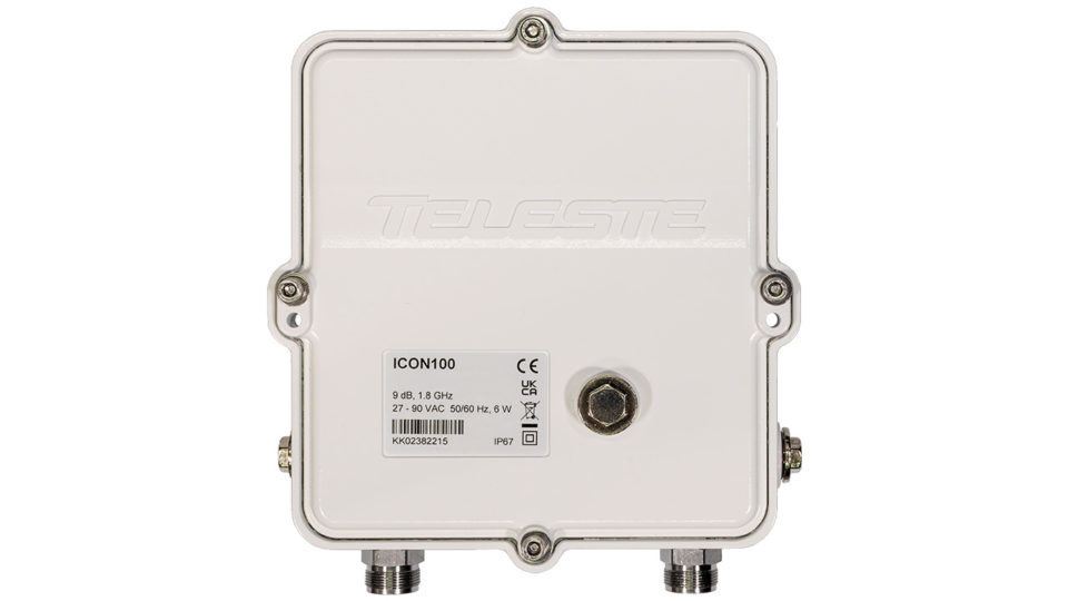 A white, rectangular ICON100 booster amplifier with a rugged enclosure, embossed "Teleste" logo, and a label indicating the model "ICON100." The device has multiple screws securing the cover, a central metallic connector on top, and two coaxial cable connectors at the bottom.